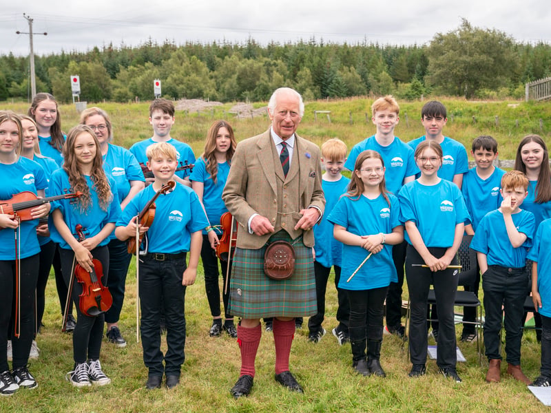 King Charles III meets members of the Feis air an Oir community music group