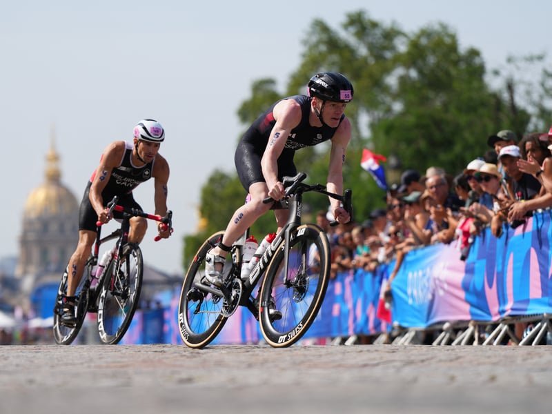 Sam Dickinson, right, did not finish the race but celebrated Yee's win for Team GB.