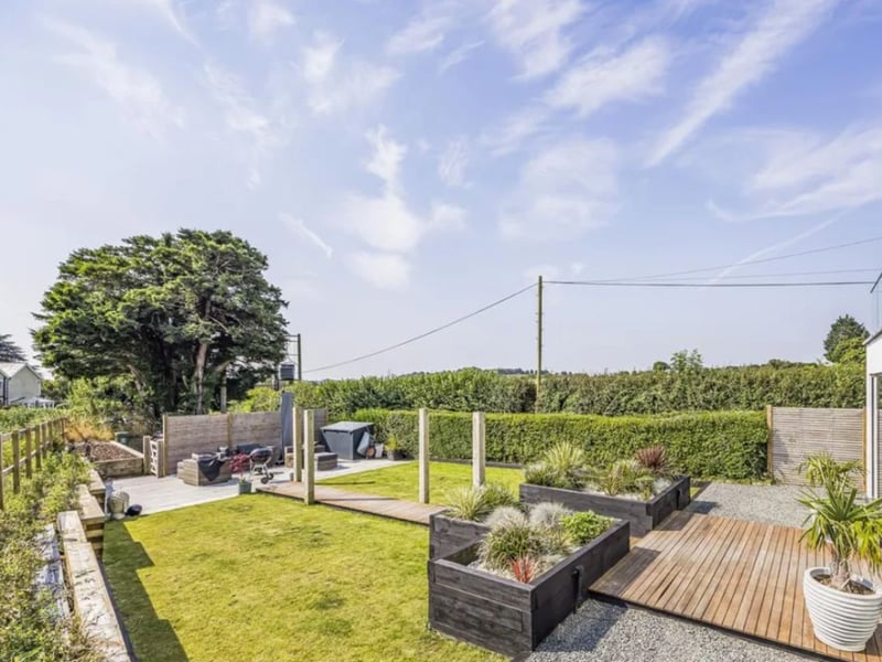 This stunning home comes with four bedrooms, three bathrooms and two reception rooms. 