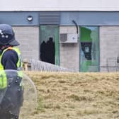 A police officer in front of the wrecked Holiday Inn Express at Manvers in Rotherham, which was the scene of an anti-immigration protest on Sunday (August 5) attanded by at least 8700 people. Missiles were thrown, 10 police officers were injured and a wheelie bin leaning against the hotel was set on fire.