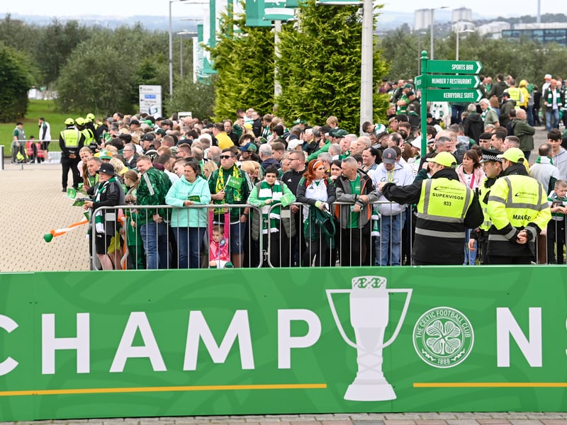 Hordes of Celtic fans await the team outside of Celtic Park.
