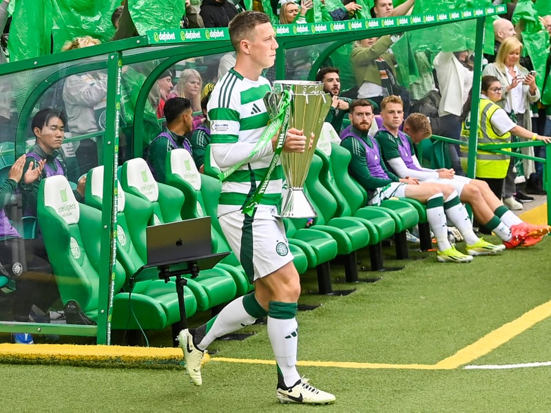Celtic captain Callum McGregor brings out the Scottish Premiership trophy at Celtic Park.