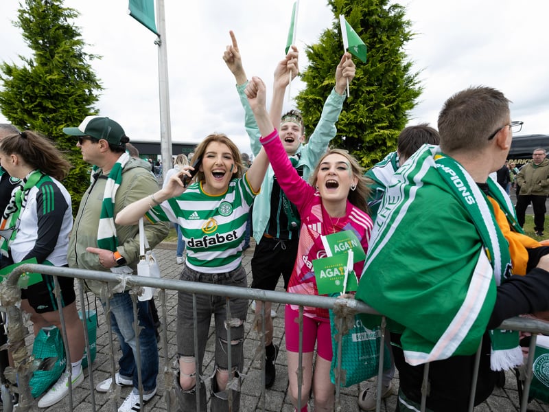 Celtic fans enjoying a song as the team arrive with the trophy.