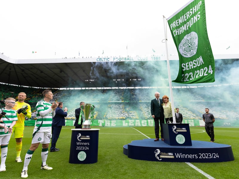 The champions flag is unfurled at Celtic Park.