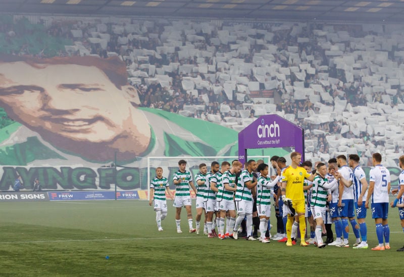 Celtic fans display Tommy Burns flag ahead of kick off.
