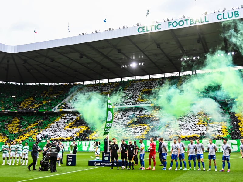 Green smoke is let off as the teams get ready for their Scottish Premiership opener.