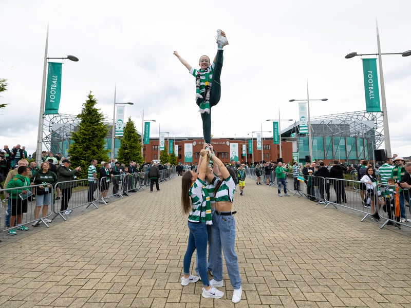 Some Hoops fans pull off a gymnastic trick ahead of the tram arriving at the stadium.