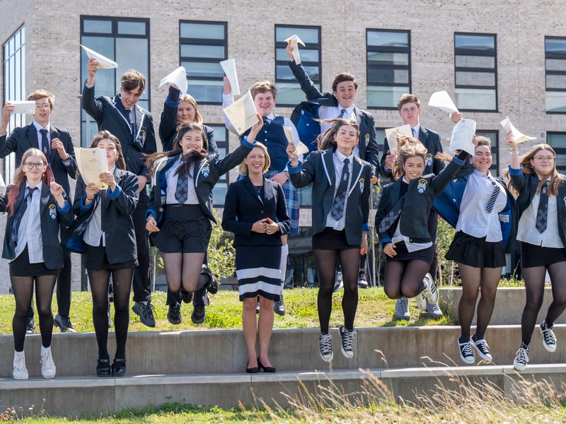 Education Secretary Jenny Gilruth celebrates with students at Madras College in St Andrews, Fife
