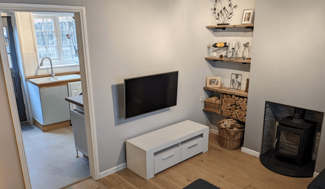 The listing says: "A delightful cottage with accommodation arranged over three floors. Replaced sash style double glazed windows with new shutters on all three levels and a new front door."