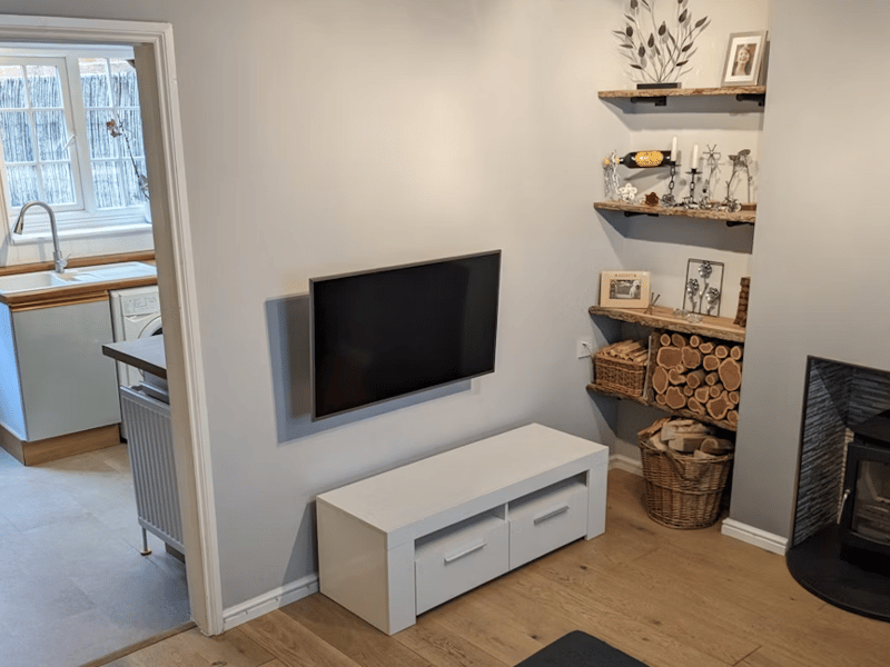 The listing says: "A delightful cottage with accommodation arranged over three floors. Replaced sash style double glazed windows with new shutters on all three levels and a new front door."