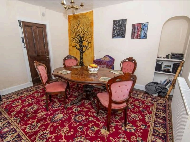 On the ground floor level, the hallway leads to the lounge which has an open fireplace, a kitchen and a separate dining room
