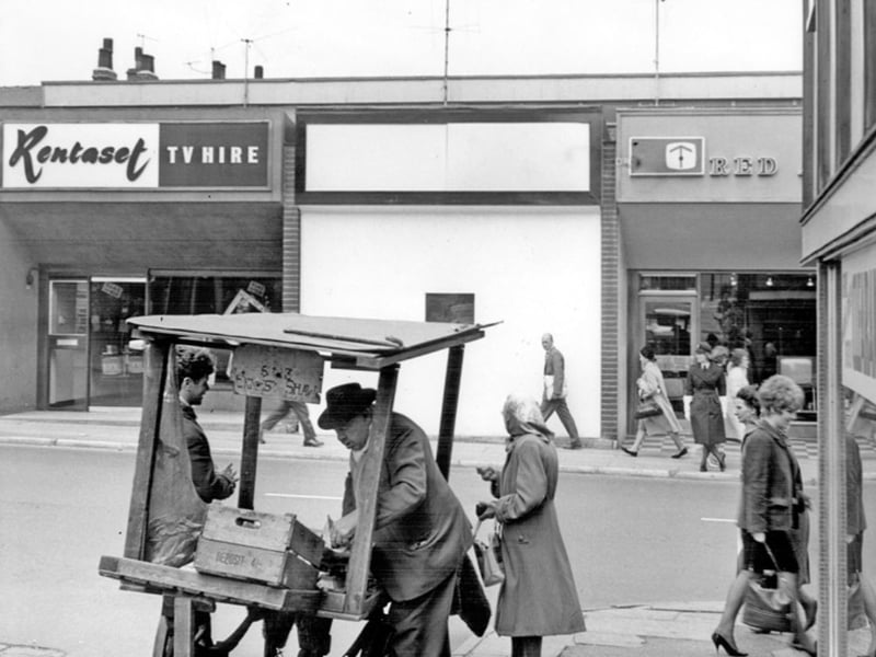 Ernest Shaw, street seller, on Attercliffe Road, Sheffield, in July 1964, with Rentaset TV rental shop in the background