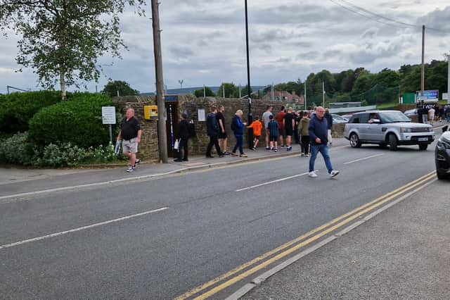 Fans head home after the match
