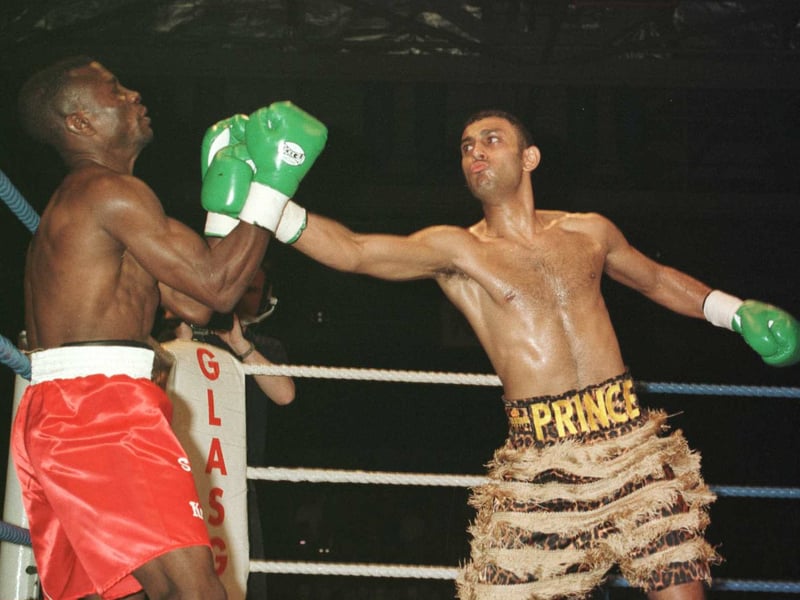 Prince Naseem Hamed knocks down Said Lawal twice in the first 35 seconds before the referee stops the fight for the WBO Featherweight Championship at the Scottish Exhibition Centre in March 1996