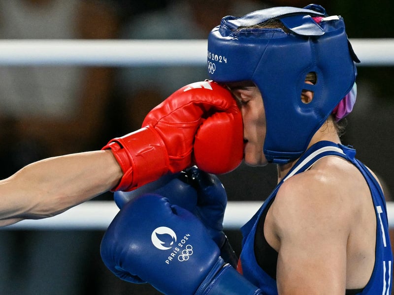 Taiwan's Lin Yu-ting and Turkey's Esra Yildiz Kahraman (Blue) compete in the women's 57kg semi-final boxing match