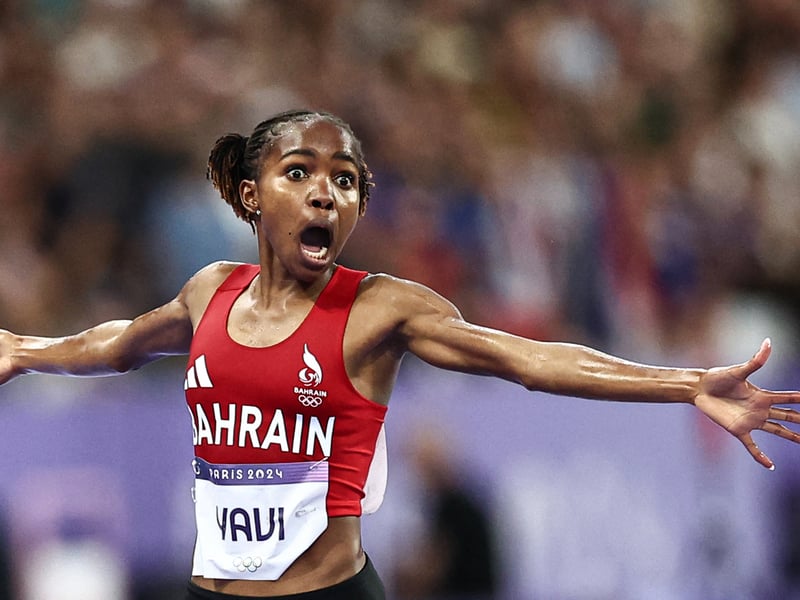 Bahrain's Winfred Mutile Yavi celebrates winning the women's 3000m steeplechase final of the athletics event