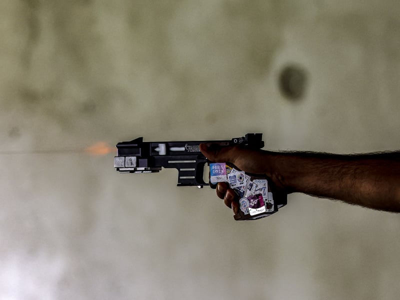 A shooter competes on the stage 2 of the 25 meters rapid fire pistol men during the Paris 2024 Olympic Games
