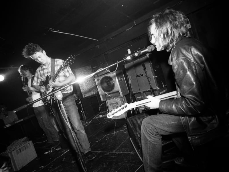 Jason Pierce (right) of Spiritualized performs on stage at King Tut's Wah Wah Hut in 1991. 
