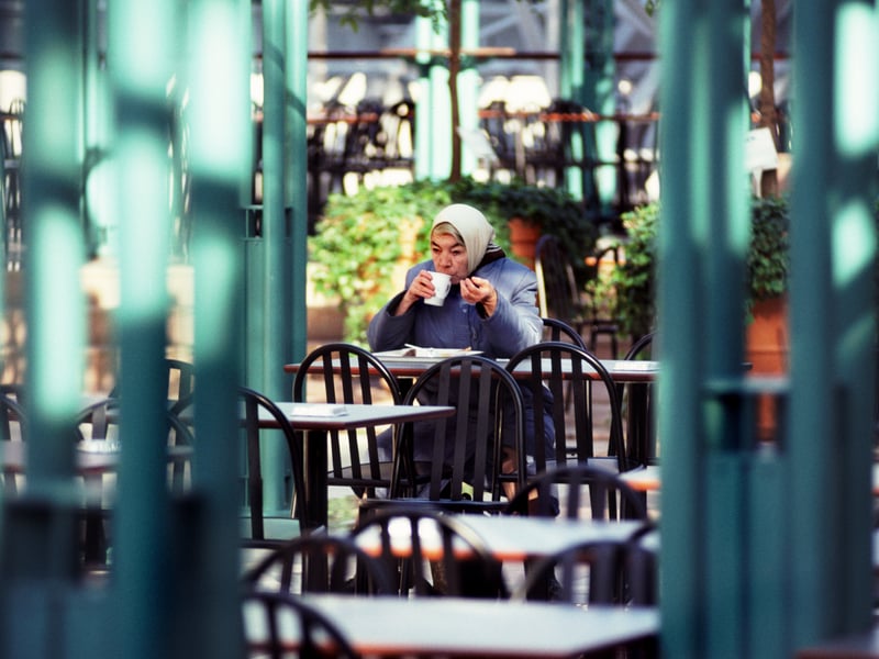 Picture shows a woman alone enjoying her cup of tea at the St Enoch centre. 