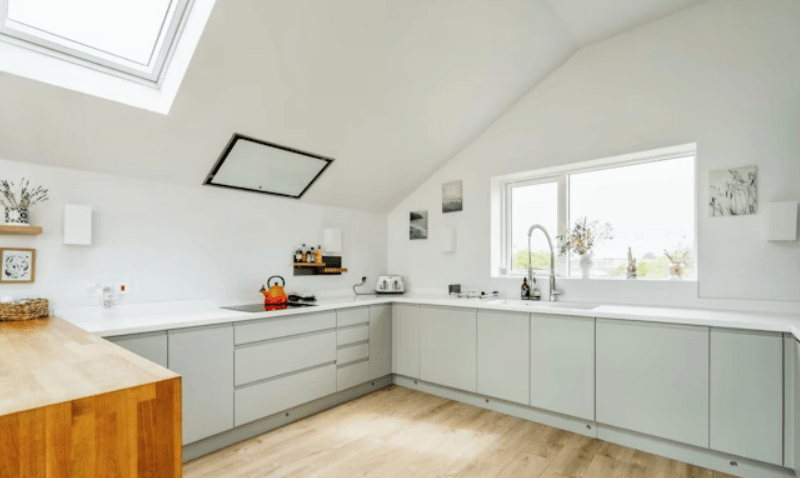 The listing says: " This A rated energy-efficient home features solar panels and an electric car charger, ensuring a reduced carbon footprint and lower energy bills."