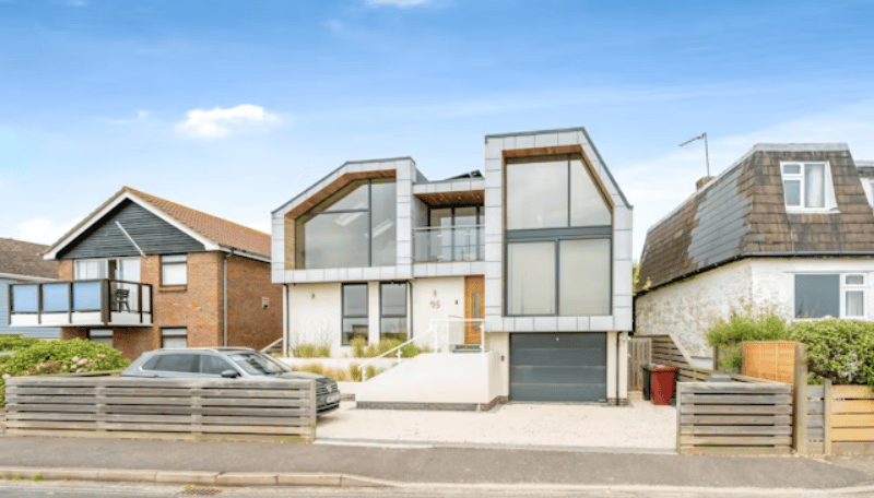 The listing says: "A stunning bespoke designed detached house, enviably situated on the seafront offering superb coastal views and excellent access to the beach opposite."