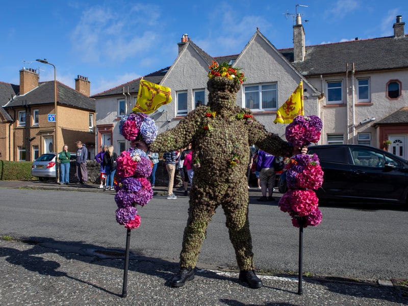 The Burryman covered head to toe in over 13,000 sticky plant heads walks the boundary of South Queensferry to ward off evil spirits as part of a 900-year-old traditional historic parade