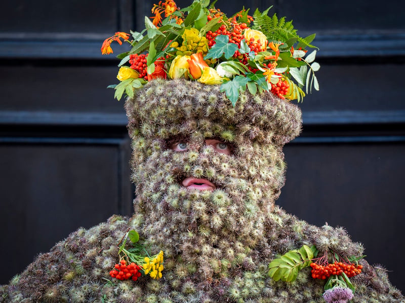 The tradition is believed to bring good luck to the towns people if they give the Burryman whisky offered through a straw or a donation of money
