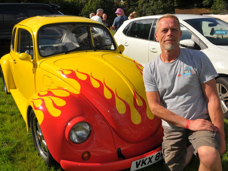 Jonnie Crabtree, of Leeds and  owner of the Herbie Hospital, with a Beetle he has renovated. (pic by Steve Riding / National World)