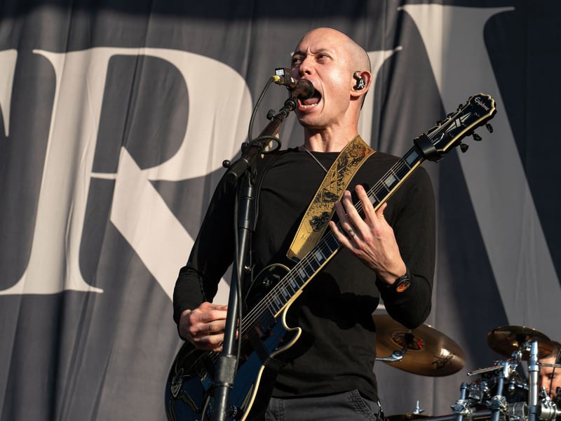 Matthew Kiichi Heafy of Trivium performs on stage at the Germania Insurance Amphitheater in Austin, Texas on August 20, 2021.