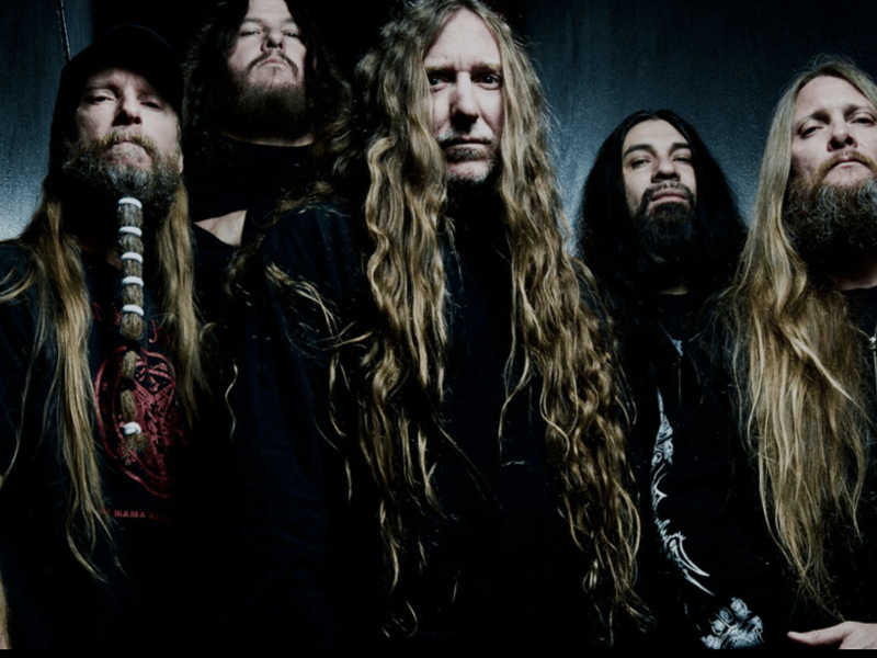 Obituary is an iconic American death metal band that emerged in the late 1980s, hailing from Tampa, Florida. Known for their heavy, groove-laden riffs, deep growls, and relentless drumming, they are considered one of the pioneers of the death metal genre.