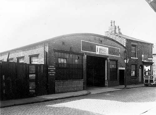 Former garage premises, in this view Leeds Coca Cola Depot. Notice states, 'Coca Cola Northern Bottler's Limited Petroleum Spirit Depot'.
