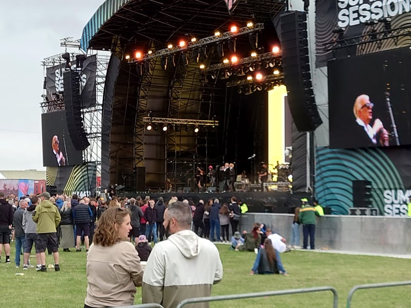 Rockers Alabama 3 provoked a big singalong in the afternoon for Sopranos theme tune 'Woke Up This Morning', with the rain coming on as their set ended.