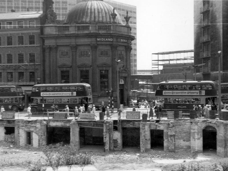 A view across to the junction of Boar Lane, left, with Wellington Street, right. In the foreground are the remains of the Royal Exchange Buildings dating from 1875. These buildings stood at the junction of Park Row with Boar Lane. The domed building is the Midland Bank on the corner of Boar Lane and Bishopgate Street. Behind it is the multi storey City House.