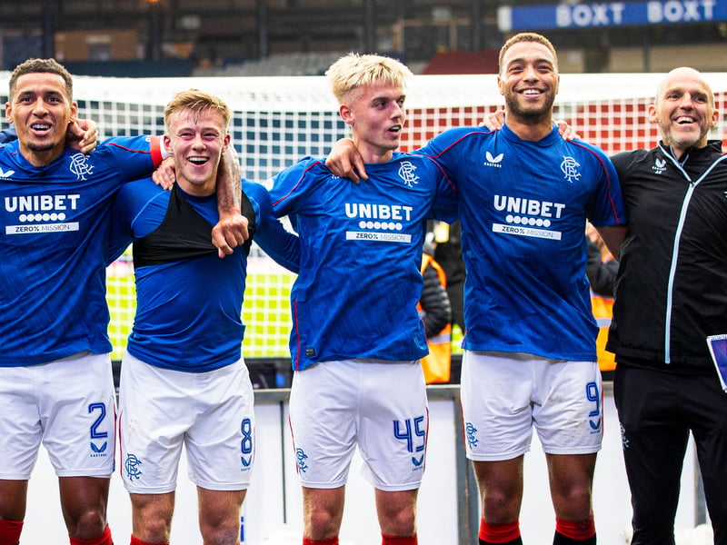 James Tavernier, Connor Barron, Ross McCausland, Cyriel Dessers and Alex Rae are full of smiles as the link arms to salute the fans.