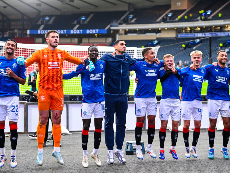 The Rangers squad celebrate at full time in front of the fans.
