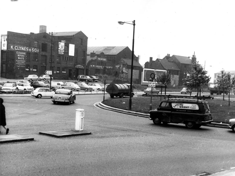 Looking towards Garden Street from the roundabout at the junction of Marsh Lane, Duke Street (in foreground), Kirkgate and East Street. Businesses on Garden Street are K. Clynes & Son, rags and waste, at no.7, J. Cohda, mantle manufacturer at no.9 and A.W. Angus & Co. Ltd., printers and bookbinders at no.13. Pictured in June 1966.