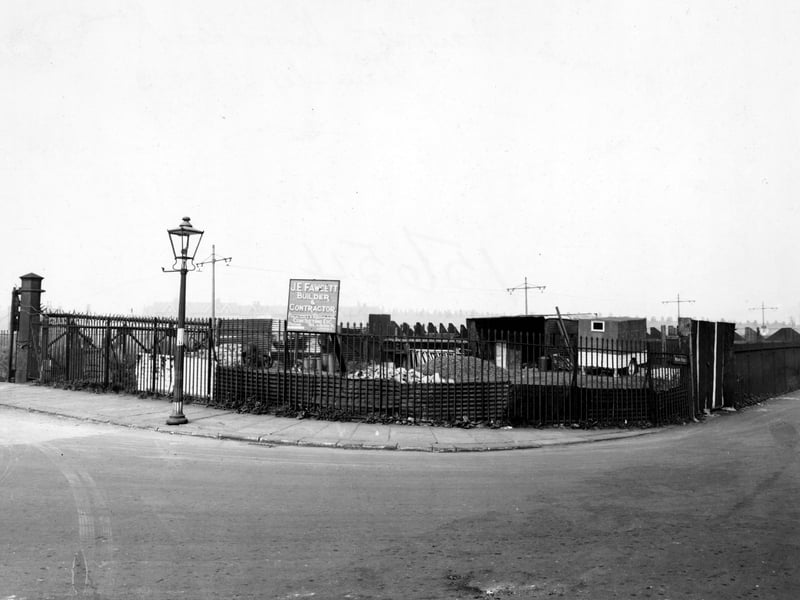 Moor Road showing J.E. Fawcett, Builders and Contractors. Street lamp on left. Power cables overhead. Pictured in October 1947.