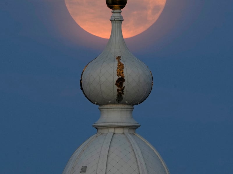 Supermoon is seen over the Smolny Convent of the Resurrection in St. Petersburg, Russia, Tuesday, Aug. 20, 2024