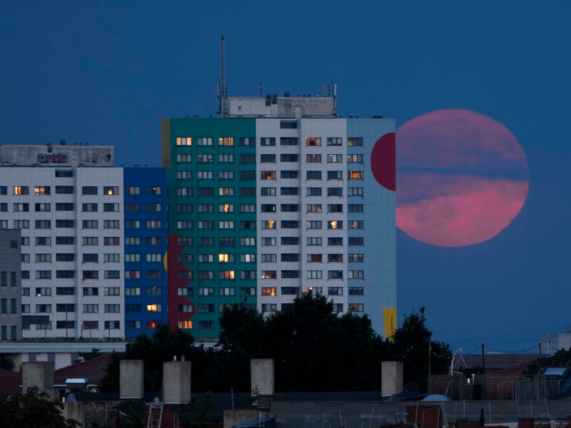 The supermoon rises behind a resident building in Berlin, Monday, Aug. 19, 2024