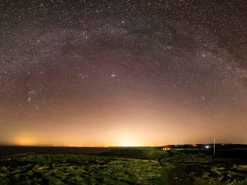 A milky way arch spans the Mull of Galloway as the dark skies of the area weave their spell.
