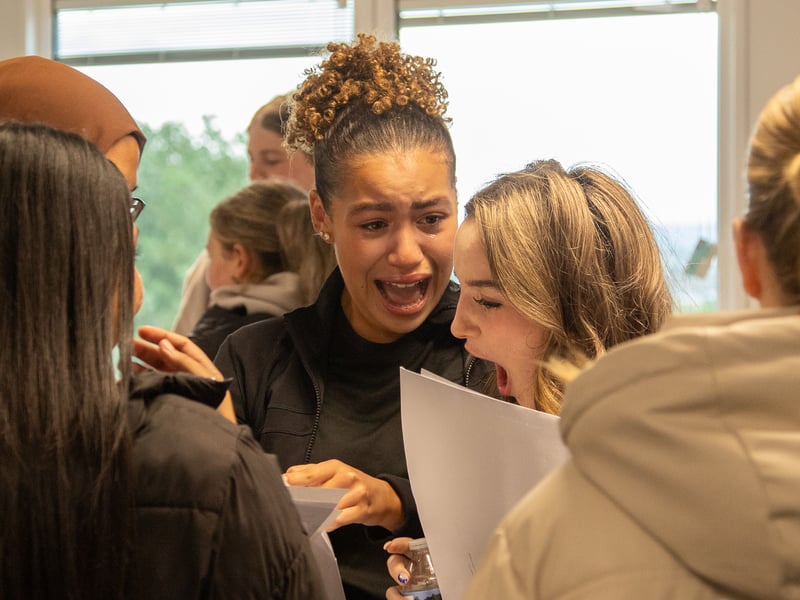 Pupils receive their GCSE results at Woodkirk Academy.