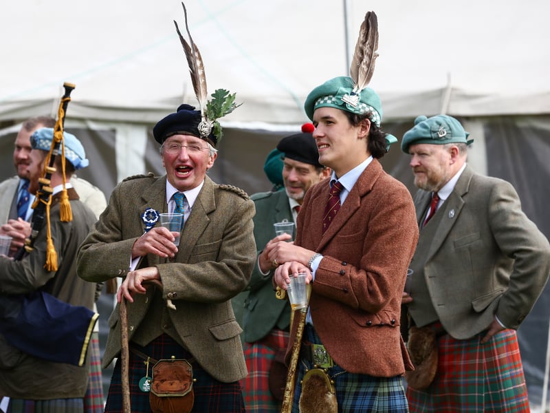 Dignitaries enjoy a whisky during the Argyllshire Gathering on August 22, 2024 in Oban