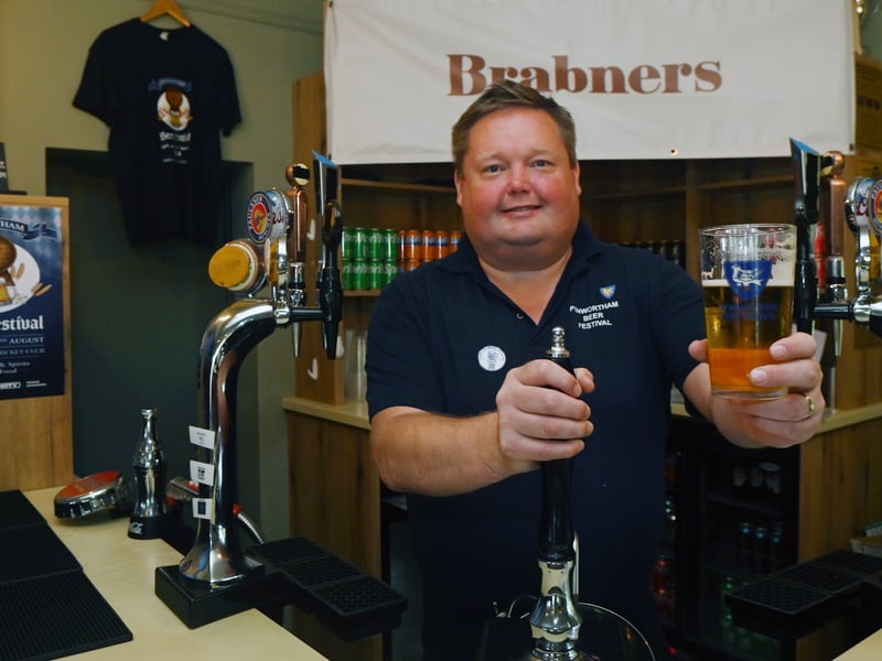 Enjoying a pint in the sun over bank holiday weekend at Penwortham Beef Festival 2024 held at Penwortham Cricket Club.