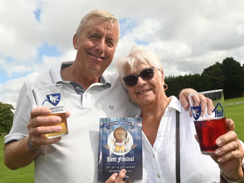Enjoying a pint in the sun over bank holiday weekend at Penwortham Beef Festival 2024 held at Penwortham Cricket Club.