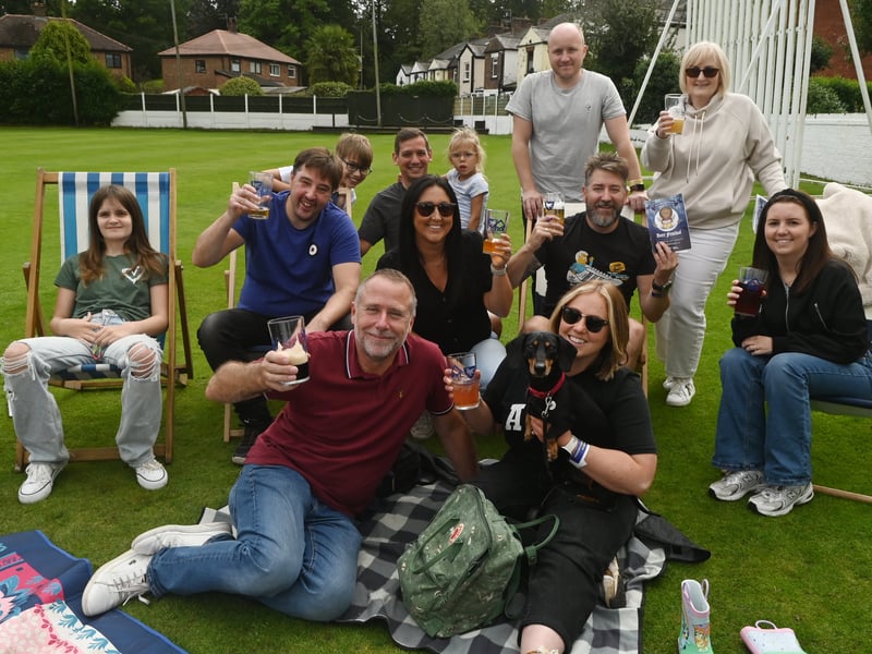 Enjoying a pint in the sun over bank holiday weekend at Penwortham Beef Festival 2024 held at Penwortham Cricket Club.