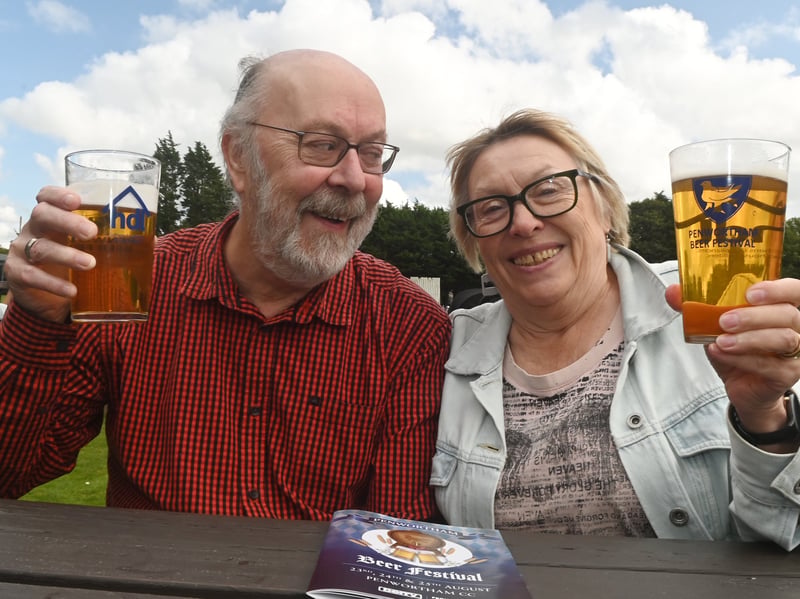 Enjoying a pint in the sun over bank holiday weekend at Penwortham Beef Festival 2024 held at Penwortham Cricket Club.