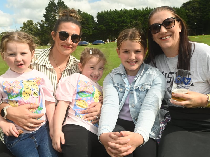 Enjoying a pint in the sun over bank holiday weekend at Penwortham Beef Festival 2024 held at Penwortham Cricket Club.