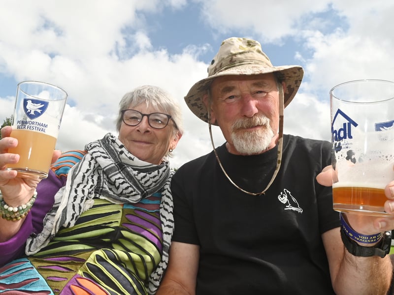 Enjoying a pint in the sun over bank holiday weekend at Penwortham Beef Festival 2024 held at Penwortham Cricket Club.
