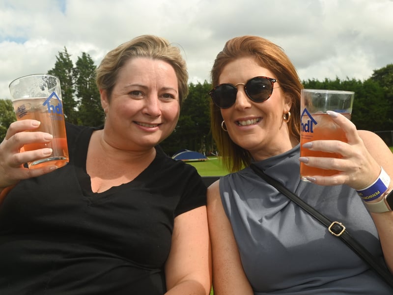 Enjoying a pint in the sun over bank holiday weekend at Penwortham Beef Festival 2024 held at Penwortham Cricket Club.