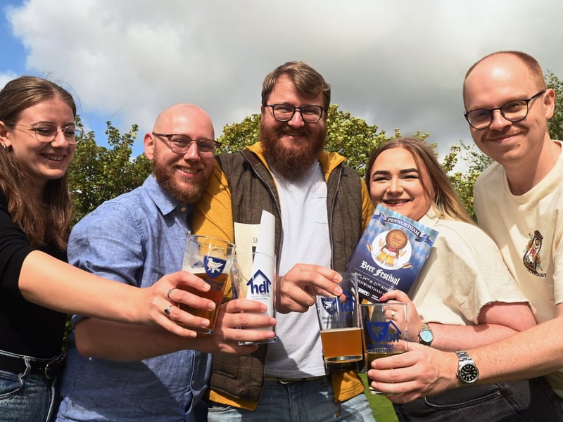 Enjoying a pint in the sun over bank holiday weekend at Penwortham Beef Festival 2024 held at Penwortham Cricket Club.